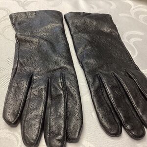Women’s black leather gloves lined made in the Philippines never worn.